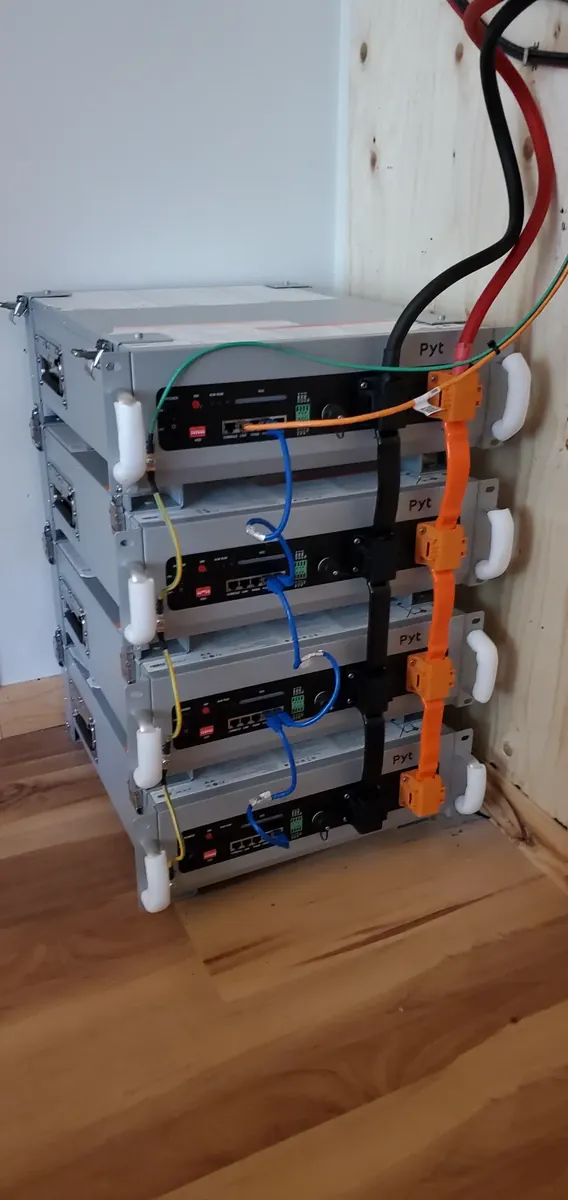 Vertical stack of battery modules with power cabling.