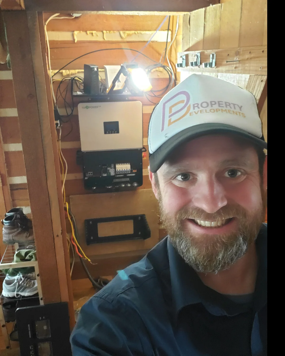 Vincent Borg, Founder and Technical Lead of Property Developments, inspecting off-grid power equipment at a remote property