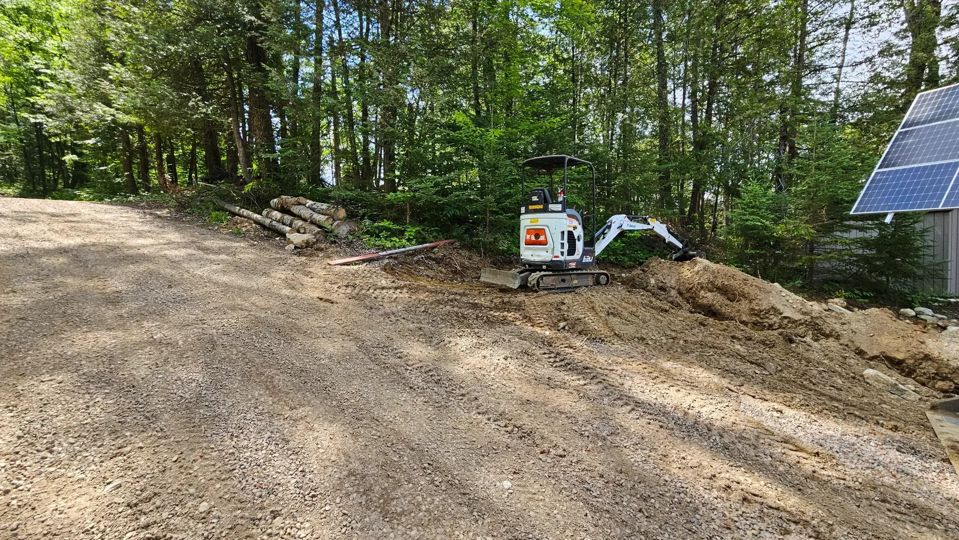 Remote rural work site showing access, equipment, and solar-system conditions